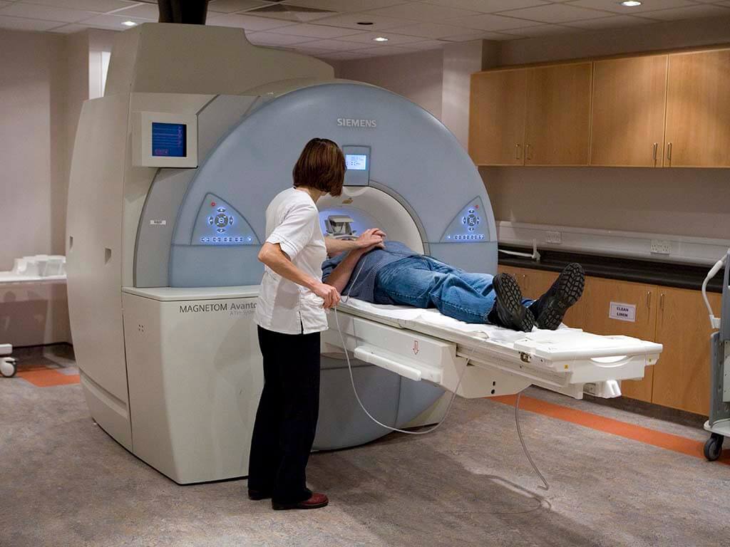 Doctor administering scan